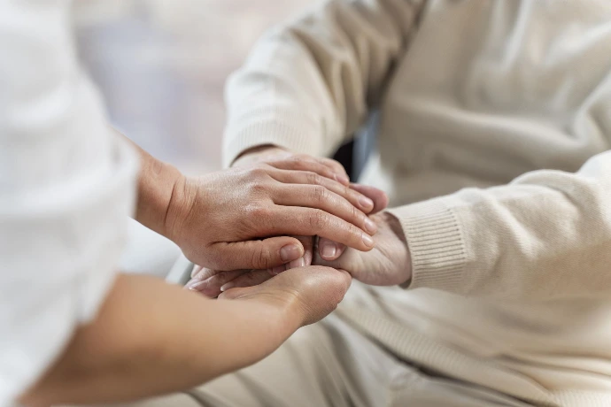 supporting hand holding